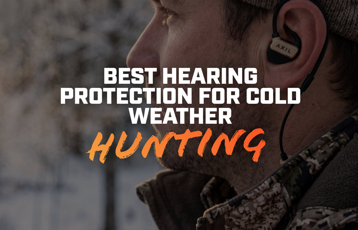 Hunter in a snowy tree stand at first light wearing a beanie and GS Extreme 3.0 earbuds